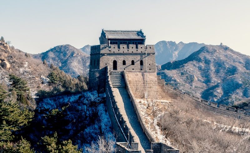 the great wall of china with snow on the ground