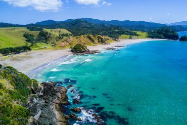 aerial view of beach with mountains