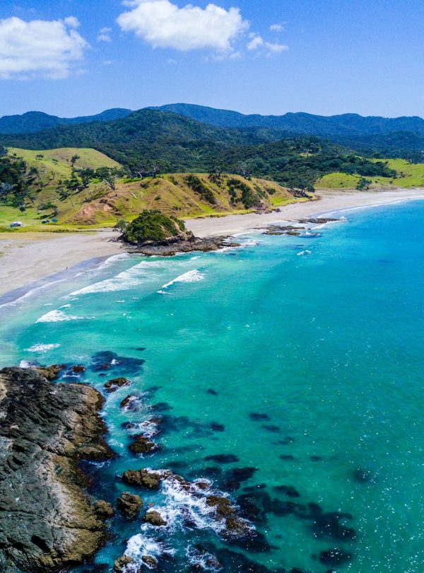 aerial view of beach with mountains