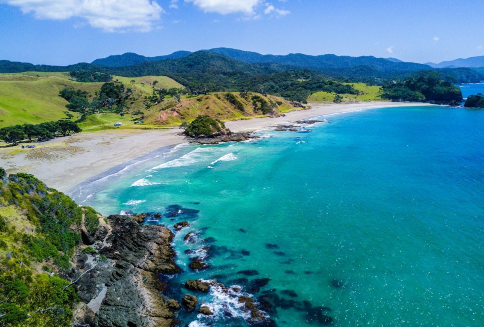 aerial view of beach with mountains