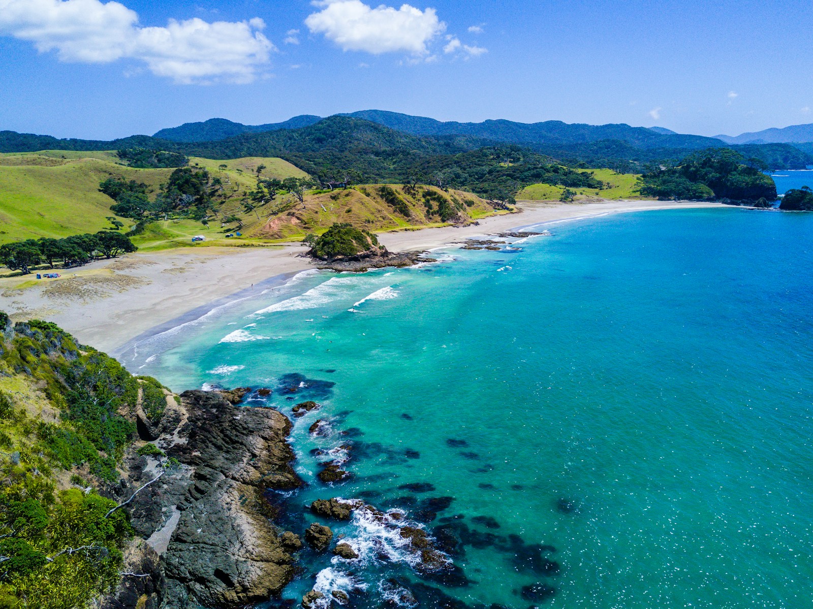 aerial view of beach with mountains