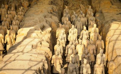 brown stone wall with human face carved